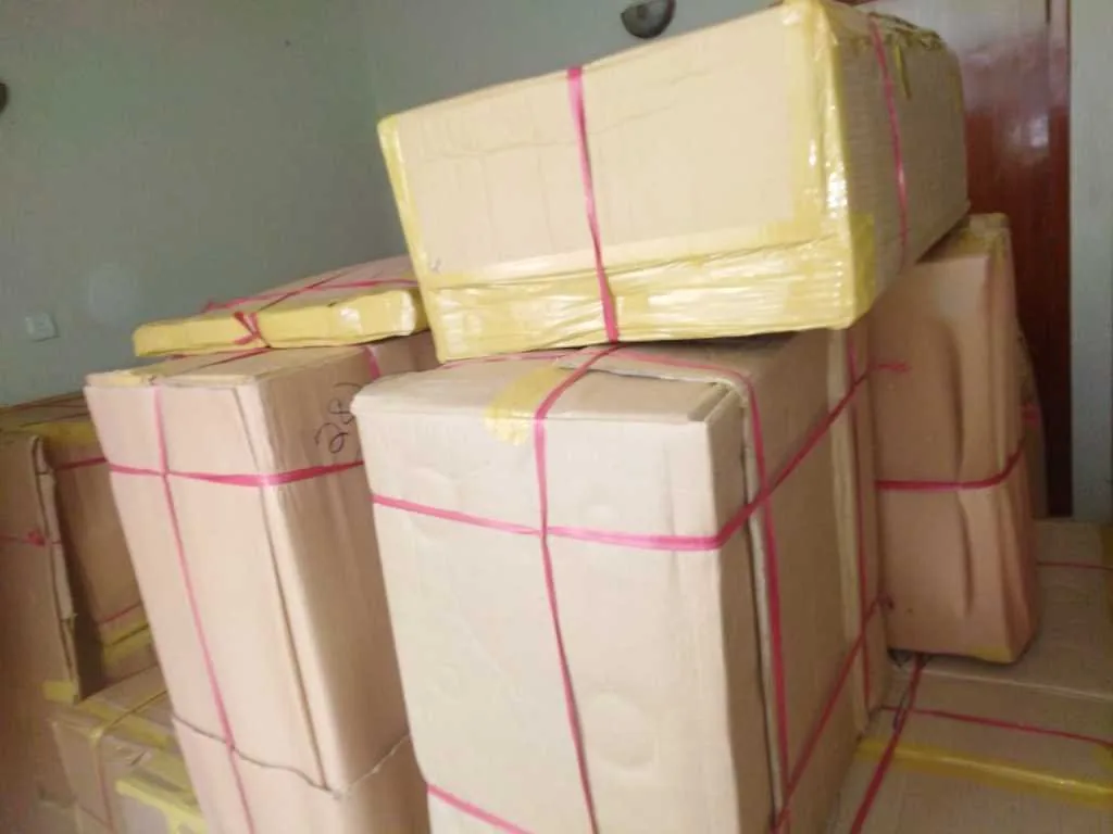 Wrapped and strapped cartons stacked and ready for loading onto the truck